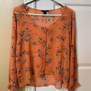 Sheer floral blouse.